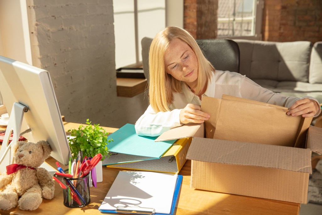 A young businesswoman moving in office, getting new work place