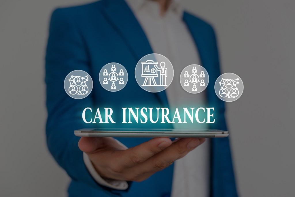 Text sign showing Car Insurance. Business photo showcasing Accidents coverage Comprehensive Policy Motor Vehicle Guaranty Male human wear formal work suit presenting presentation using smart device