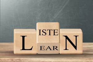 Turned a wooden cube and changed the word. Business, education and listen and learn concept.