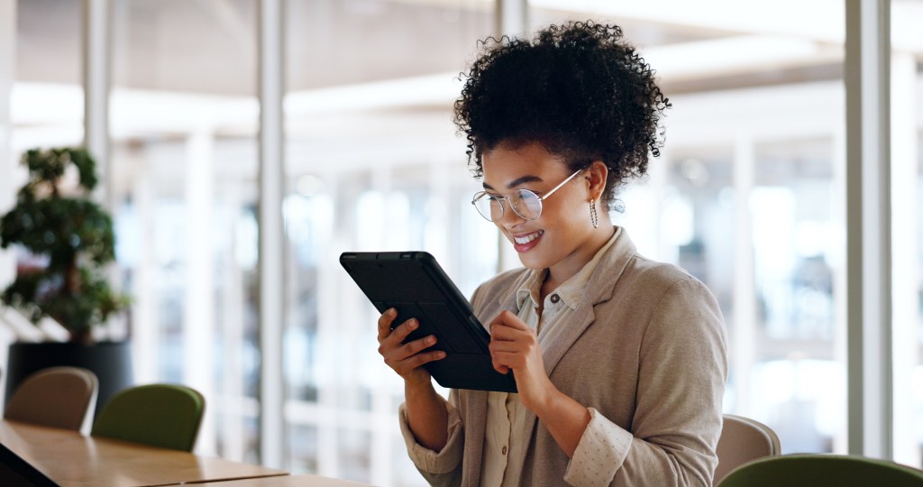 Tablet, black woman and business marketing, social media update or networking with smile. Website, company blog or online communication, office worker with glasses smile for digital strategy success.