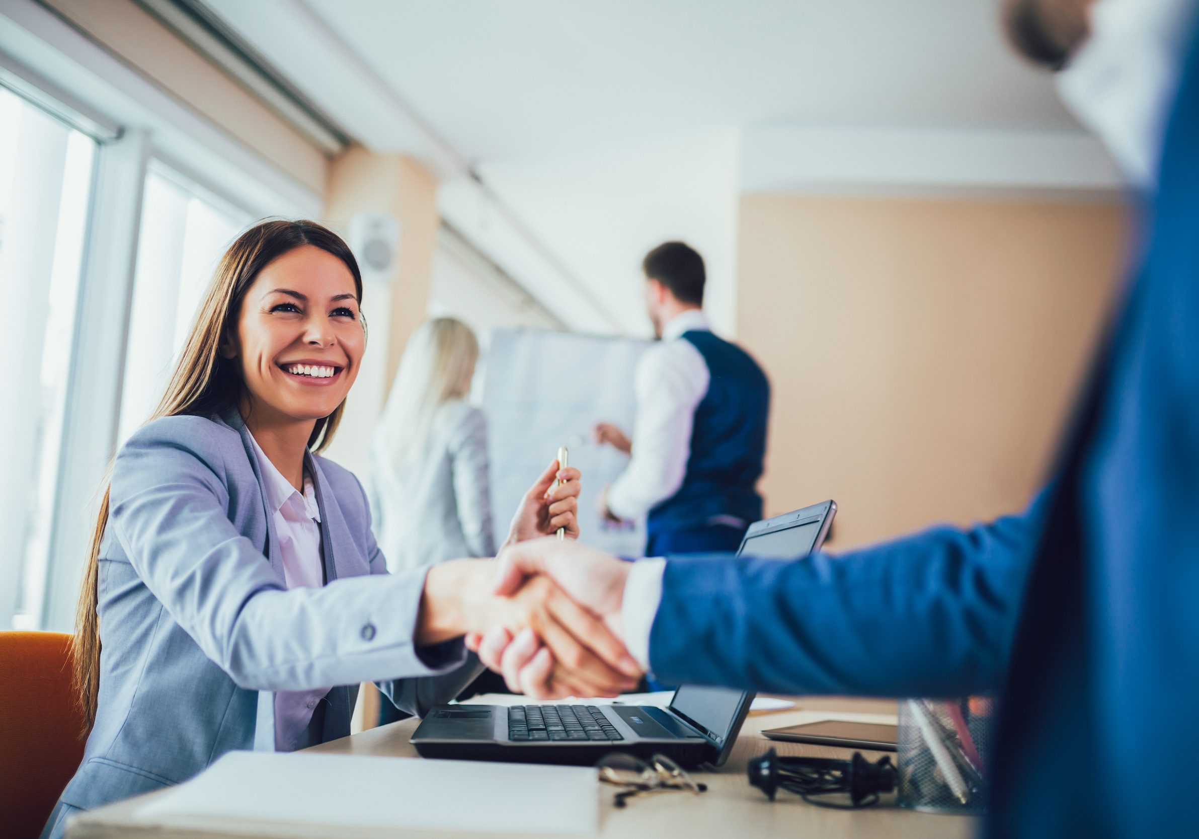 Close-up of business people handshaking